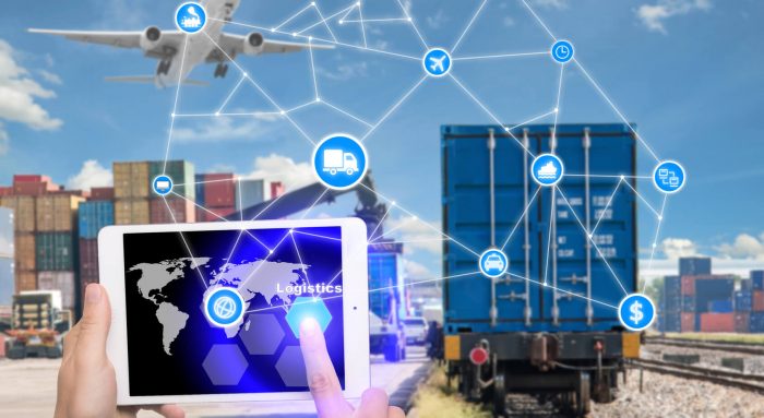 Hand holding tablet is pressing button Logistics connection technology Best Transport WordPress Themes